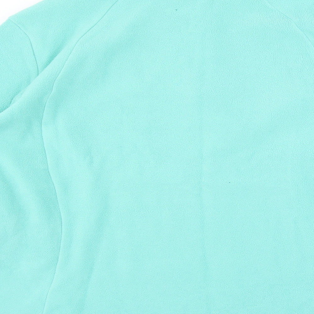 Brand and care label for Quechua women’s green jumper, size L