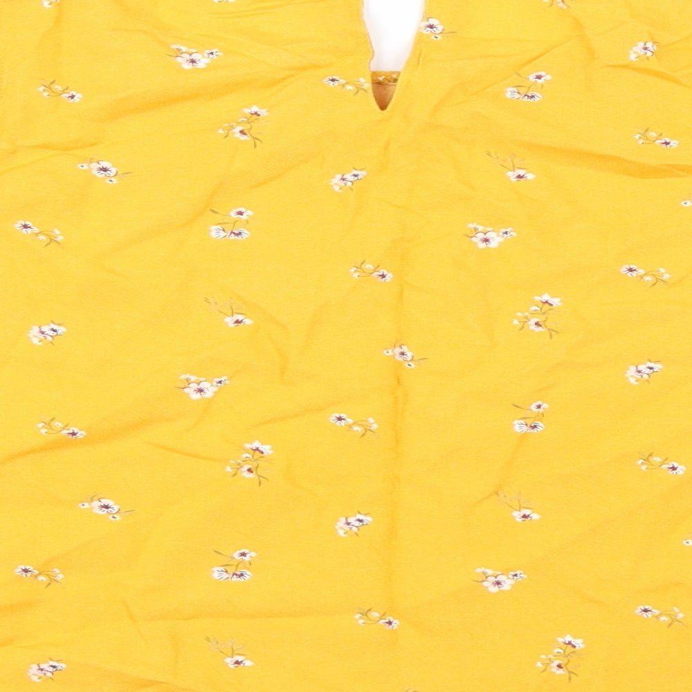 Brand and care label for H&M girls’ yellow floral tunic blouse, size 12, years - cold shoudler