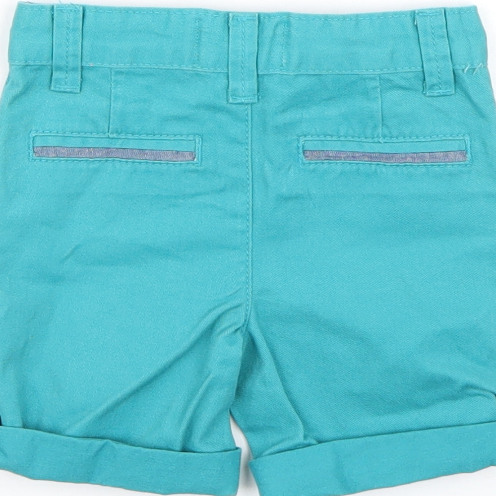 Brand and care label for Denim & Co. boys’ blue cropped trousers, size 6-9, months