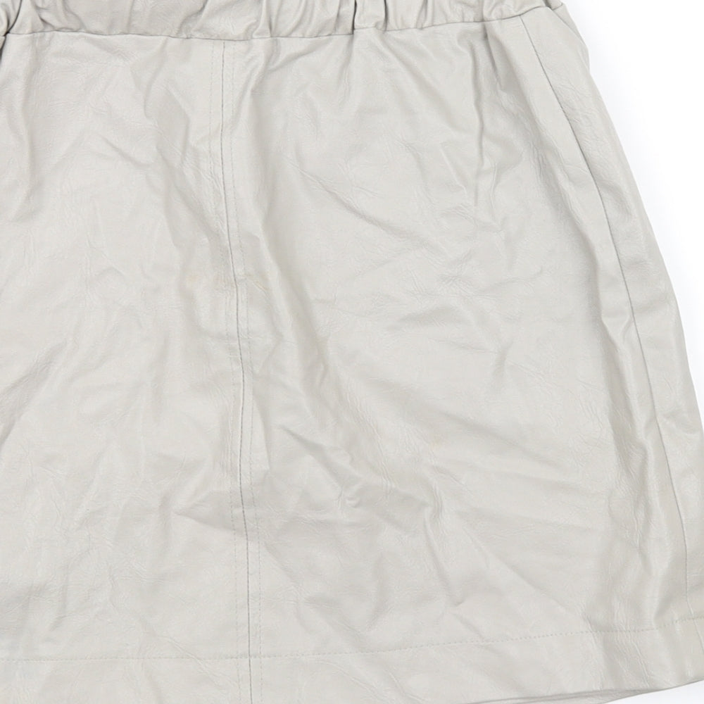 Brand and care label for Topshop women’s beige a-line skirt, size UK 8