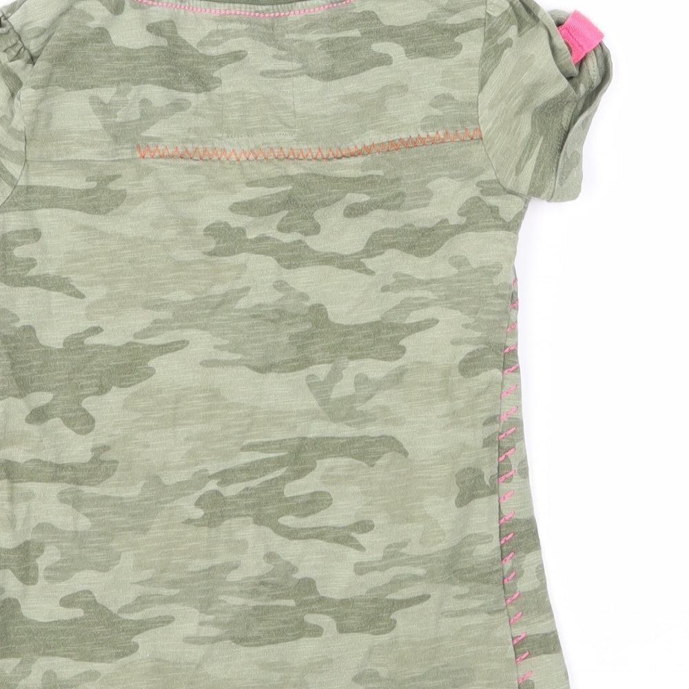 Brand and care label for Next girls’ green camouflage pullover t-shirt, size 5, years