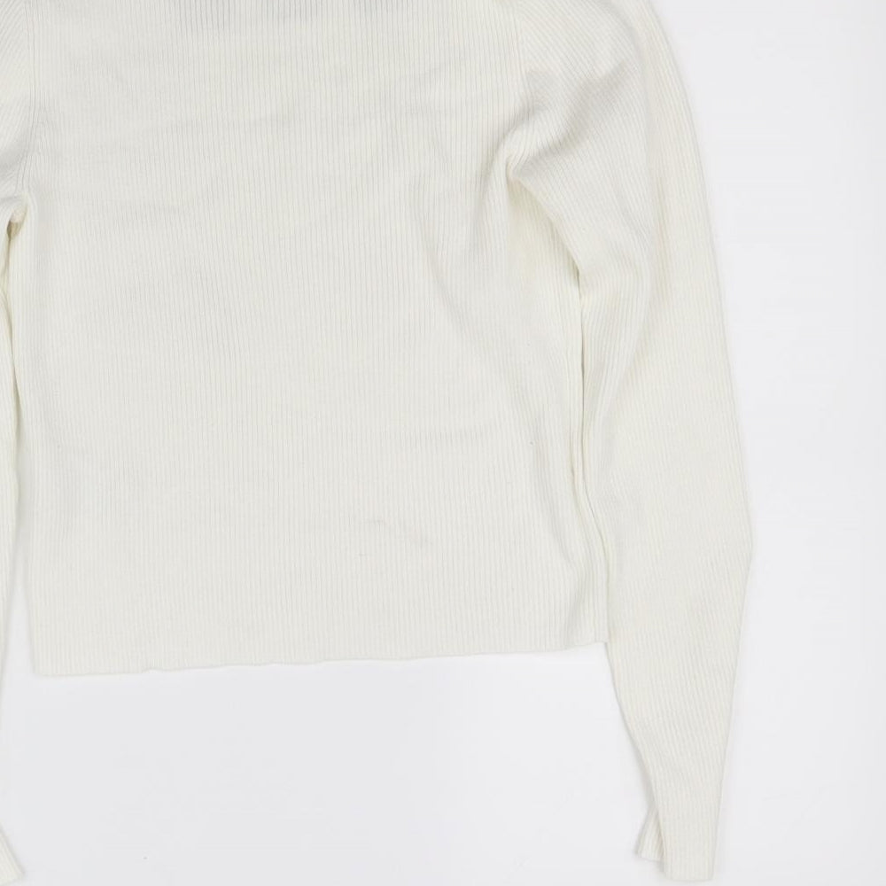 Brand and care label for pre worn girls’ white jumper, size L