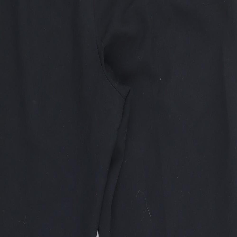Brand and care label for Marks & Spencer women’s black trousers, size UK 14