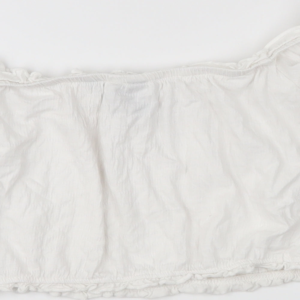 Brand and care label for New Look women’s white cropped blouse, size UK 8