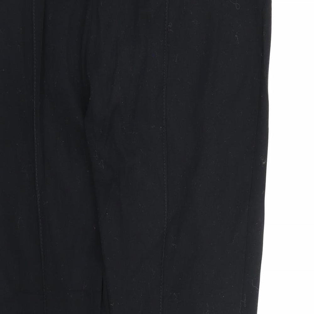Brand and care label for Marks & Spencer women’s black rayon trousers, size UK 16, 26-inch leg