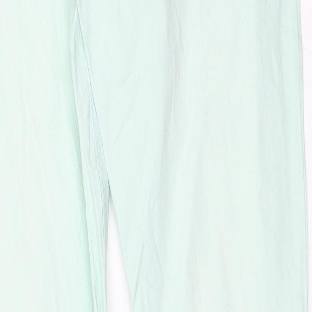 Brand and care label for Yigga girls’ green straight jeans, size 14, years