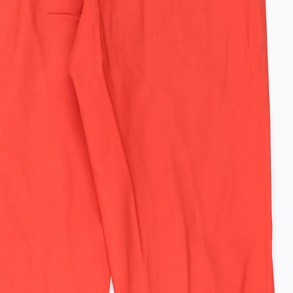Brand and care label for RESERVED women’s red trousers, size UK 34, 28-inch leg