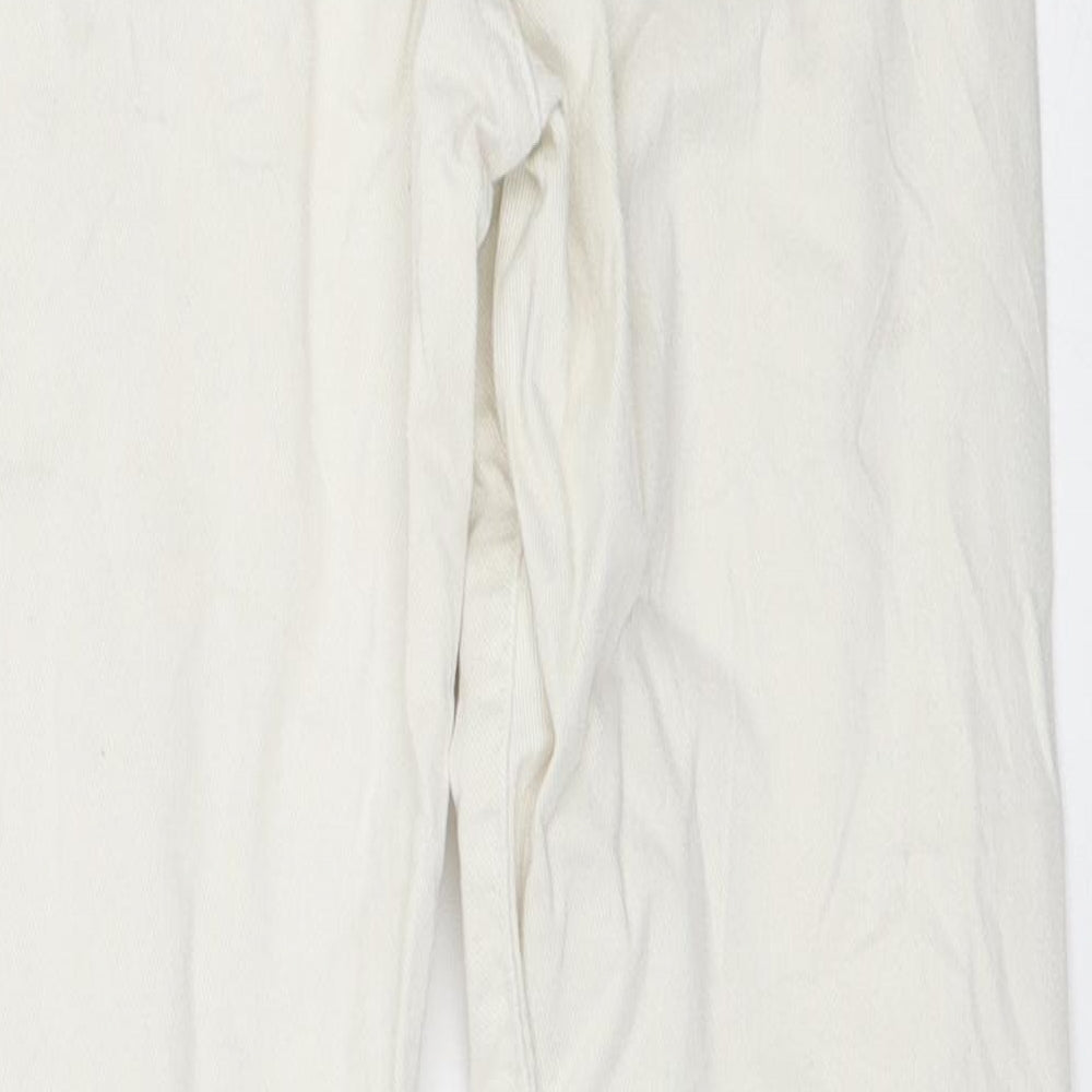 Brand and care label for women’s ivory skinny jeans, size UK 34, 26-inch leg