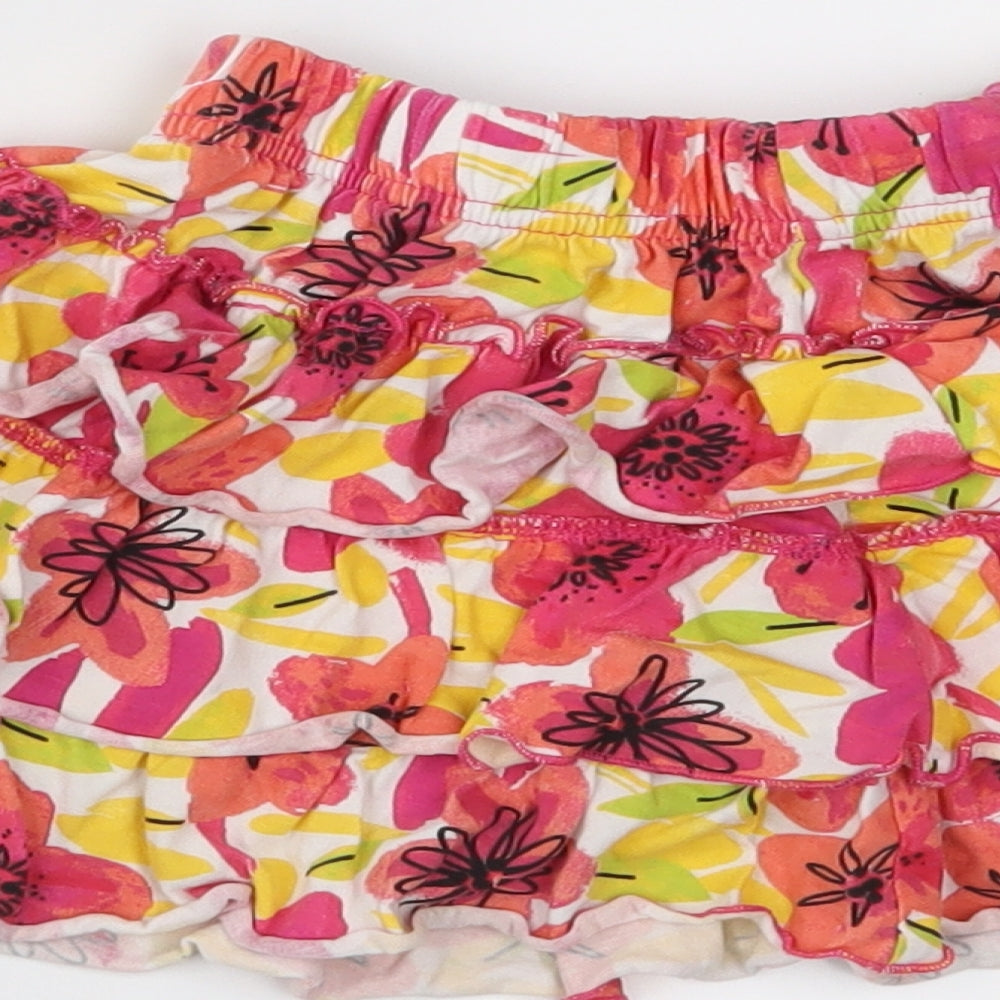 Brand and care label for Nutmeg girls’ pink floral jersey peasant skirt, size 2-3, years