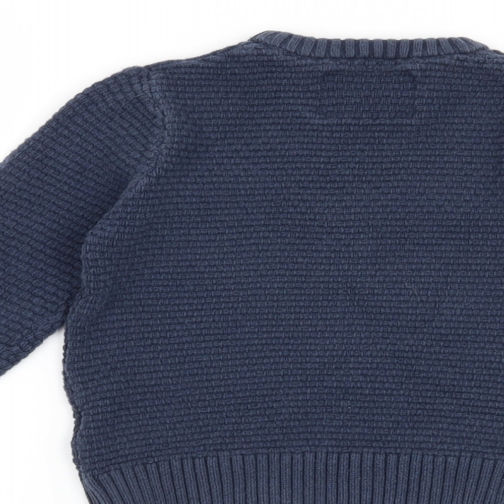 Brand and care label for Blue Zoo boys’ blue jumper, size 5-6, years