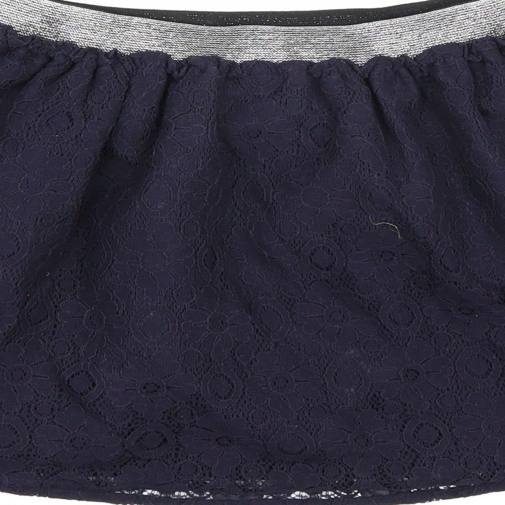 Brand and care label for Nutmeg girls’ blue floral a-line skirt, size 12-13, years