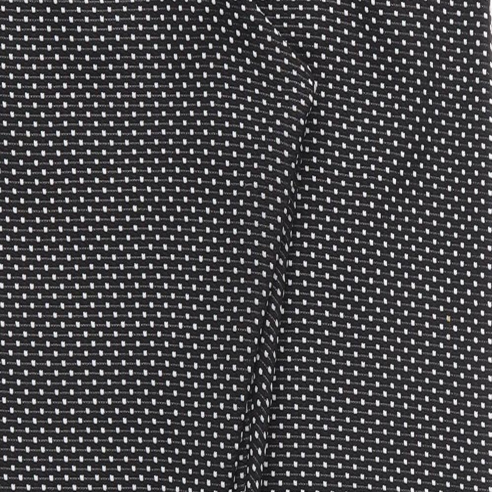 Brand and care label for Preworn women’s black polka dot trousers, size UK 10, 28-inch leg