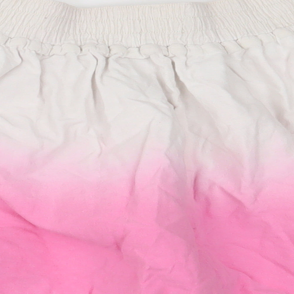 Brand and care label for Indigo girls’ pink ombré swing skirt, size 7, years