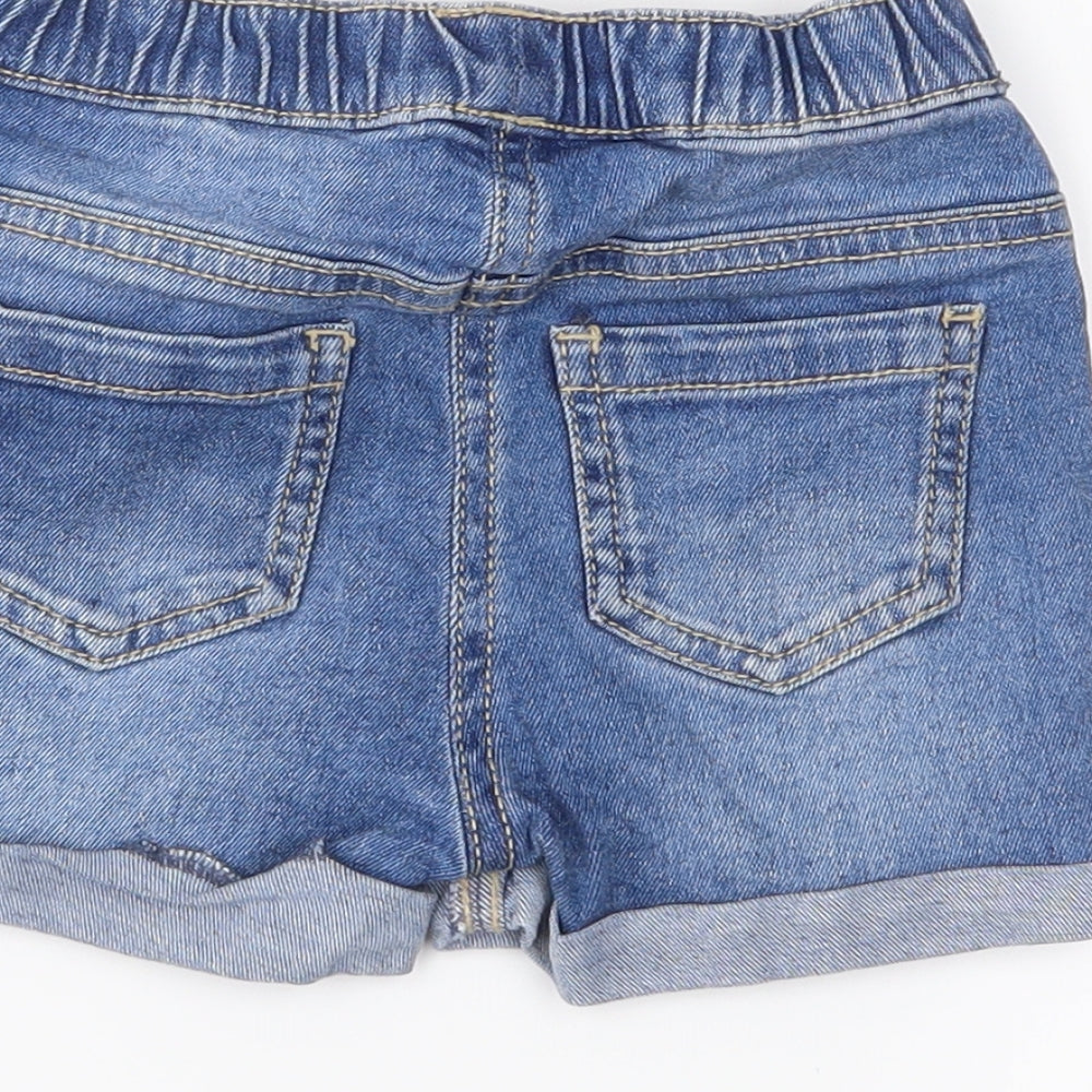 Brand and care label for Preworn girls’ blue bermuda shorts, size 2-3, years
