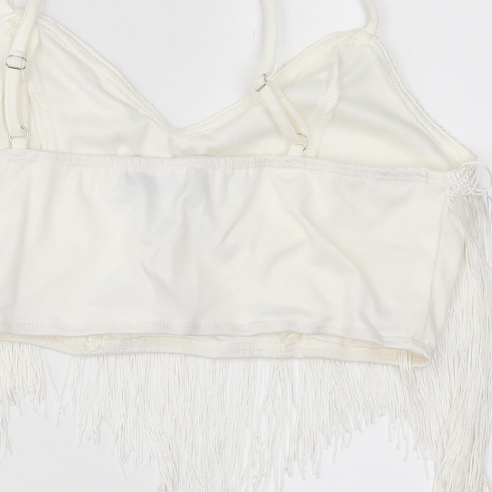 Brand and care label for PRETTYLITTLETHING women’s white cropped tank, size UK 8