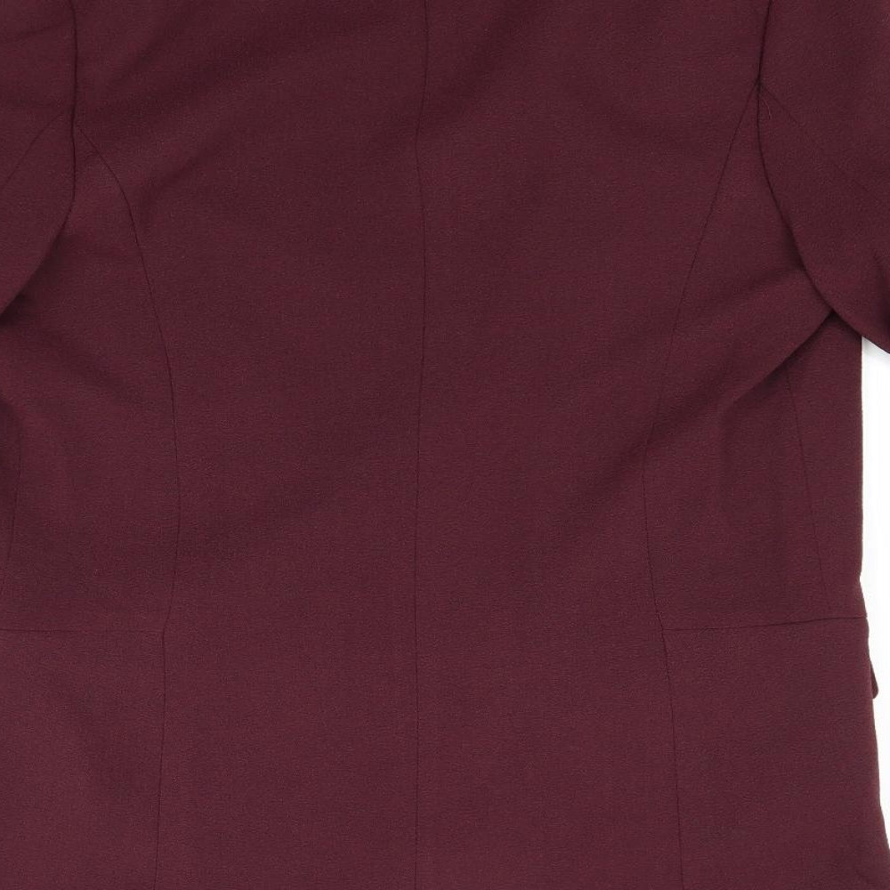 Brand and care label for Primark women’s red gilet coat, size UK 8