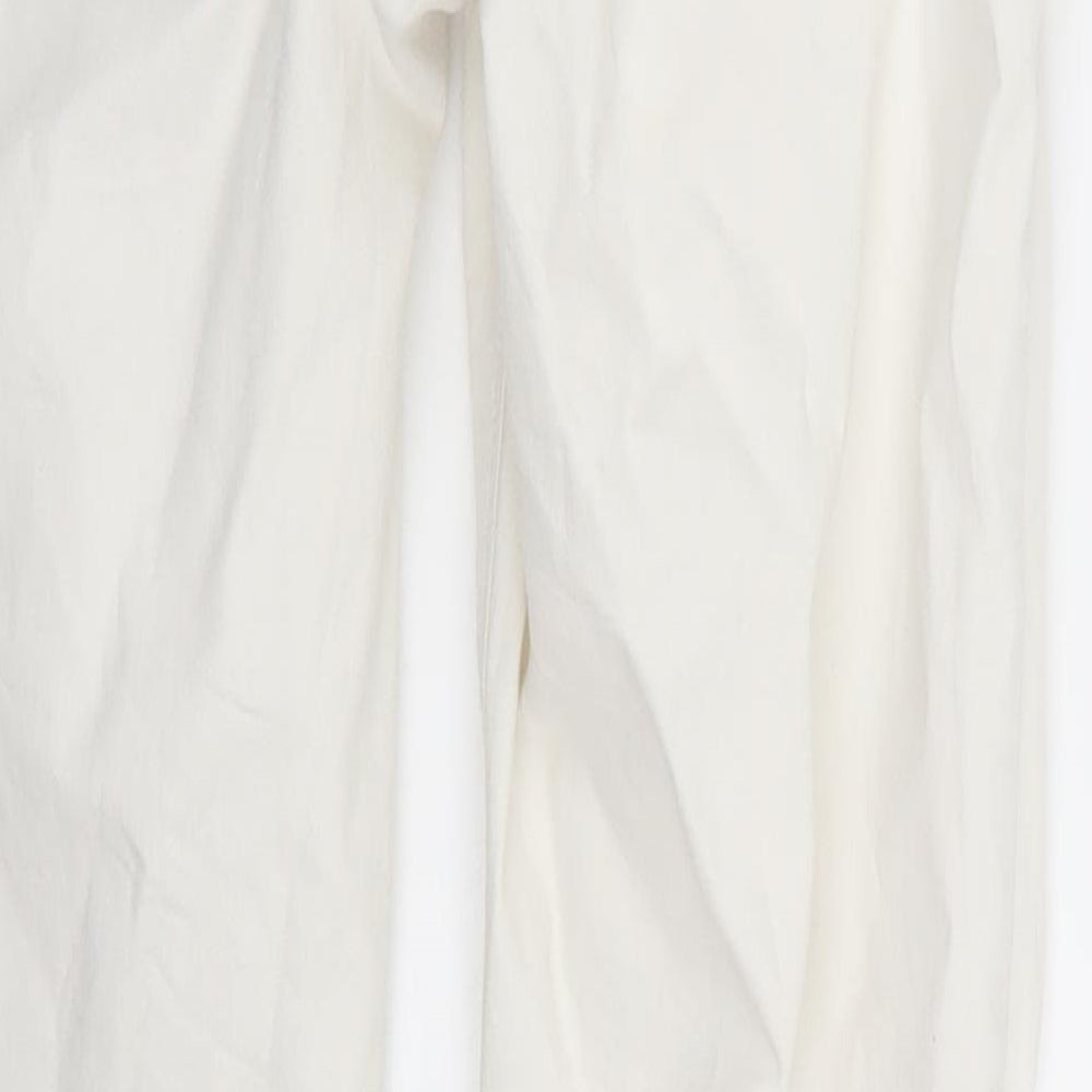 Brand and care label for women’s white skinny jeans, size UK 29, 31-inch leg