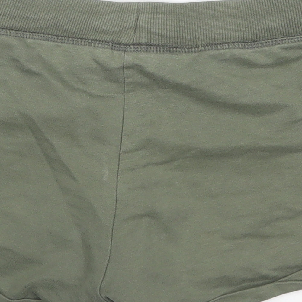 Brand and care label for H&M girls’ green hot pants shorts, size 10-11, years