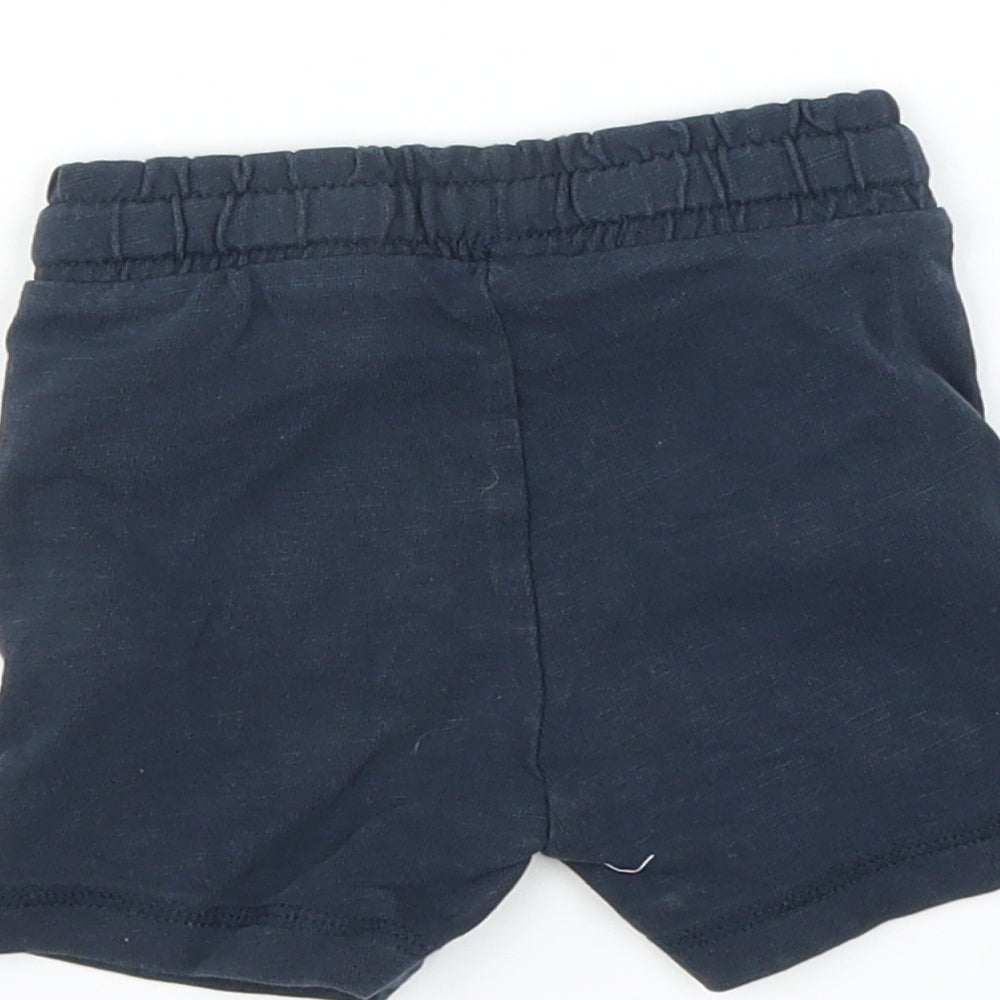 Brand and care label for Mothercare boys’ blue cropped trousers, size 3-6, months - shorts