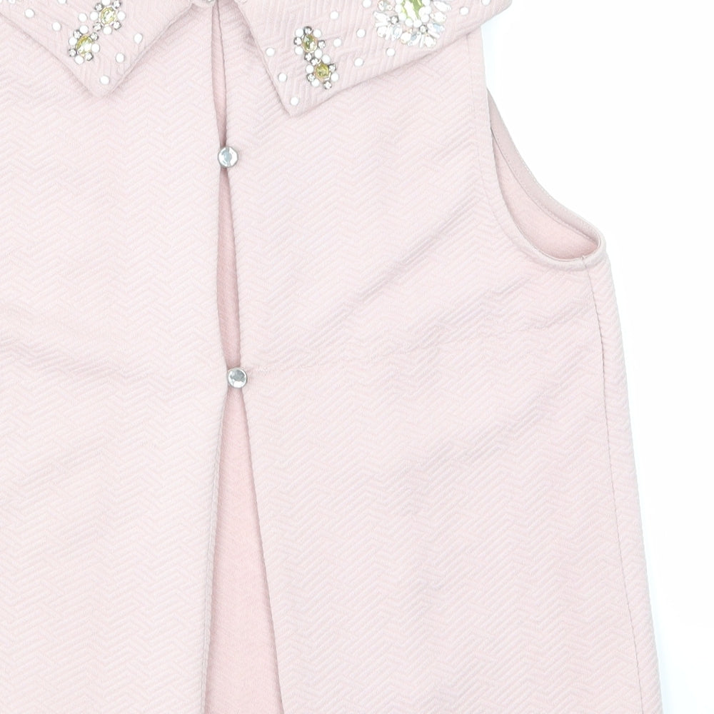 Brand and care label for Miss Selfridge women’s pink basic t-shirt, size UK 8