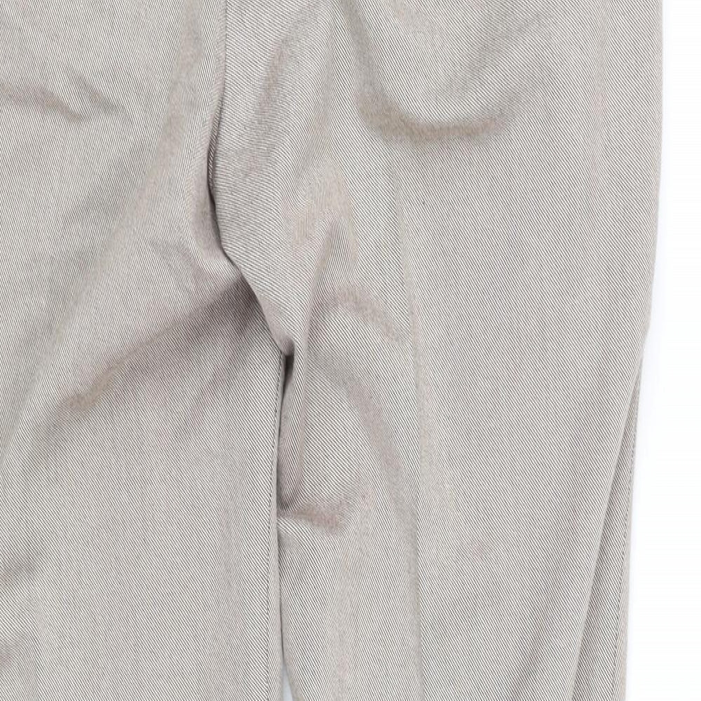 Brand and care label for pre worn men’s beige trousers, size M, 32-inch leg