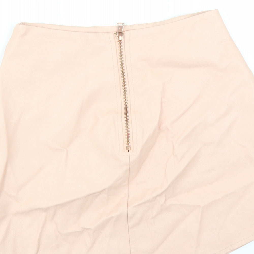 Brand and care label for Missguided women’s pink straight & pencil skirt, size UK 4