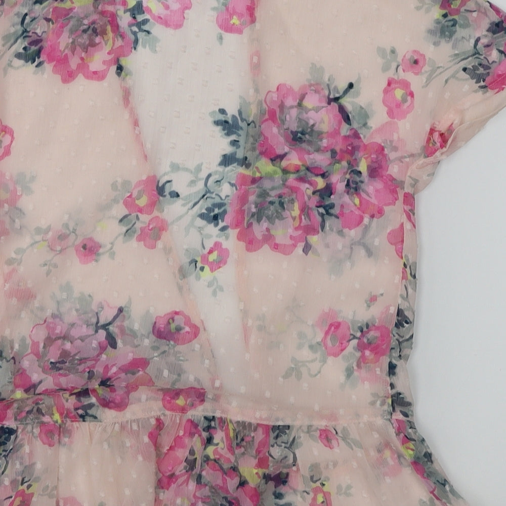 Brand and care label for Marks & Spencer girls’ pink floral kimono blouse, size 5-6, years