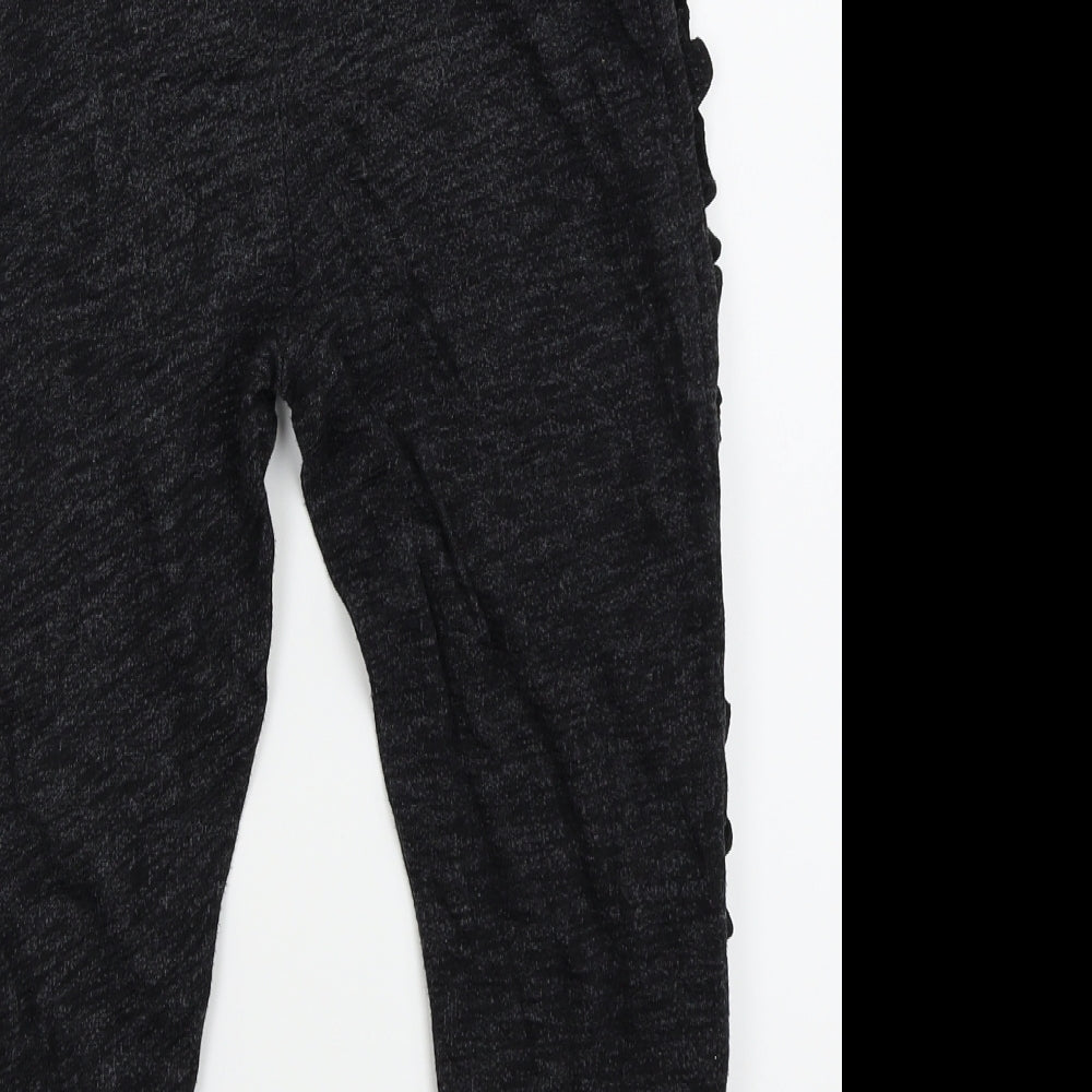 Brand and care label for outfit kids girls’ black jogger trousers, size 9, years