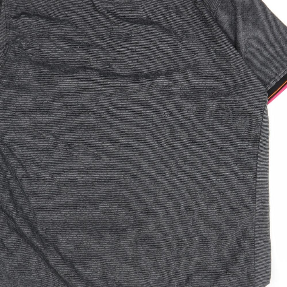 Brand and care label for Urban Spirit men’s black polo, size L