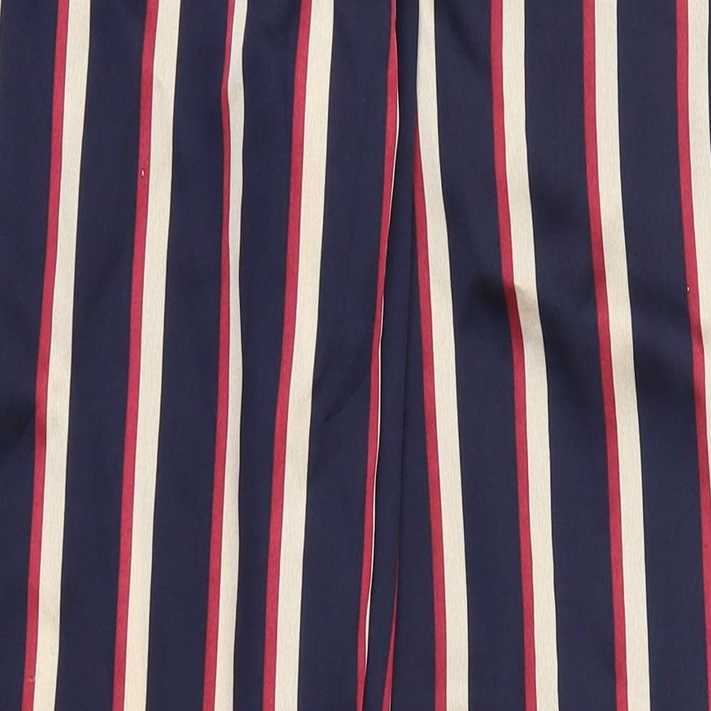 Brand and care label for PRETTYLITTLETHING women’s blue striped trousers, size UK 8, 29-inch leg