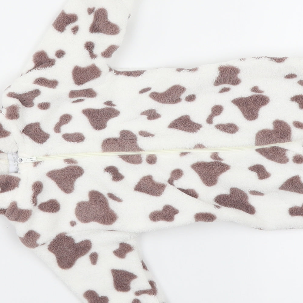 Brand and care label for Early Days girls’ white animal print kaftan one piece, size 0-3, months - cow