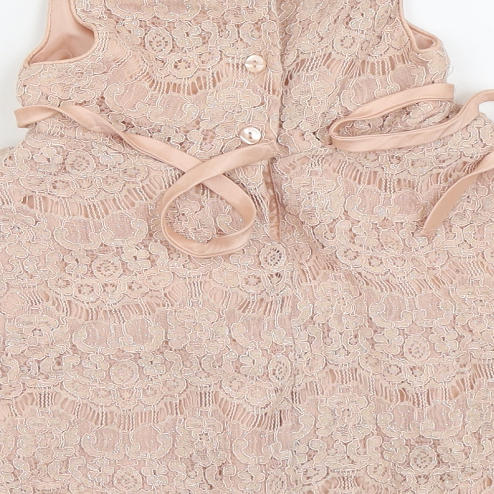 Brand and care label for Bloome girls’ pink floral fit & flare, size 24, months