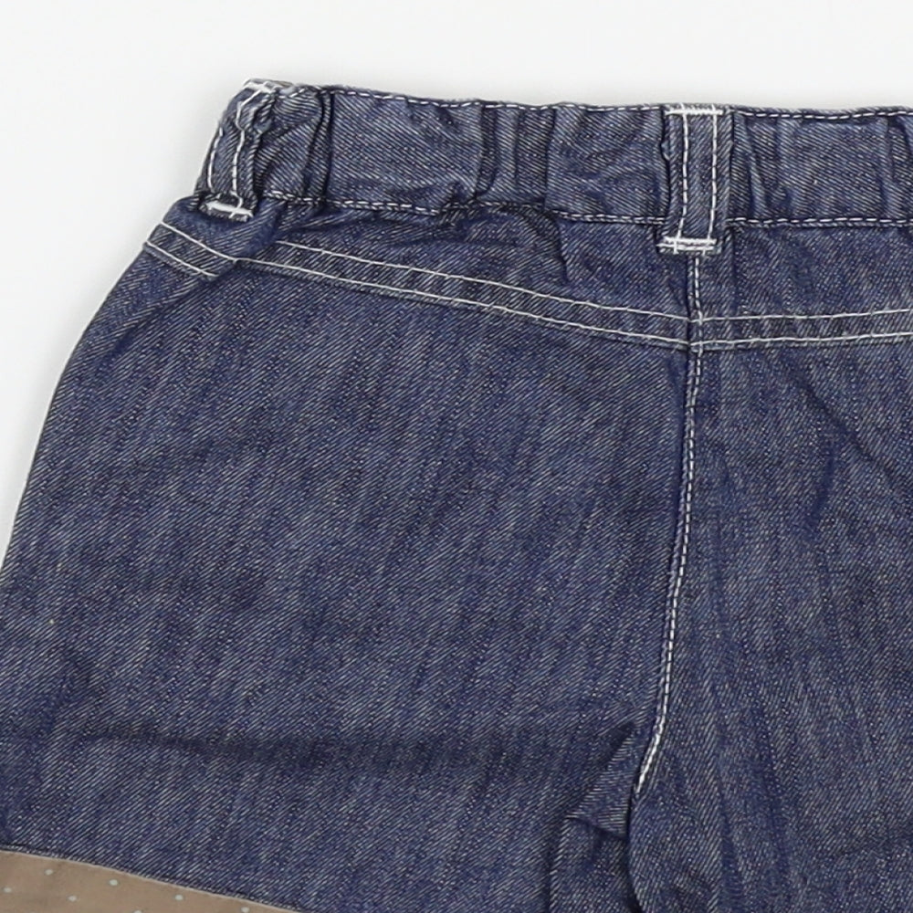 Brand and care label for Vertbaudet girls’ blue capri trousers, size 18, months - shorts