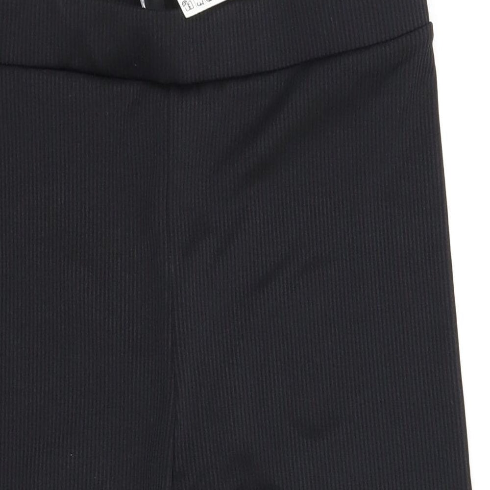 Brand and care label for H&M women’s black bermuda shorts, size M