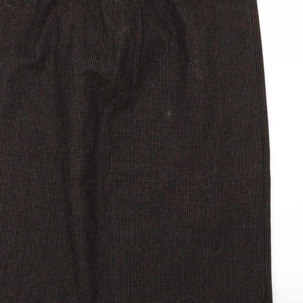 Brand and care label for Preworn women’s brown a-line skirt, size UK 34, in