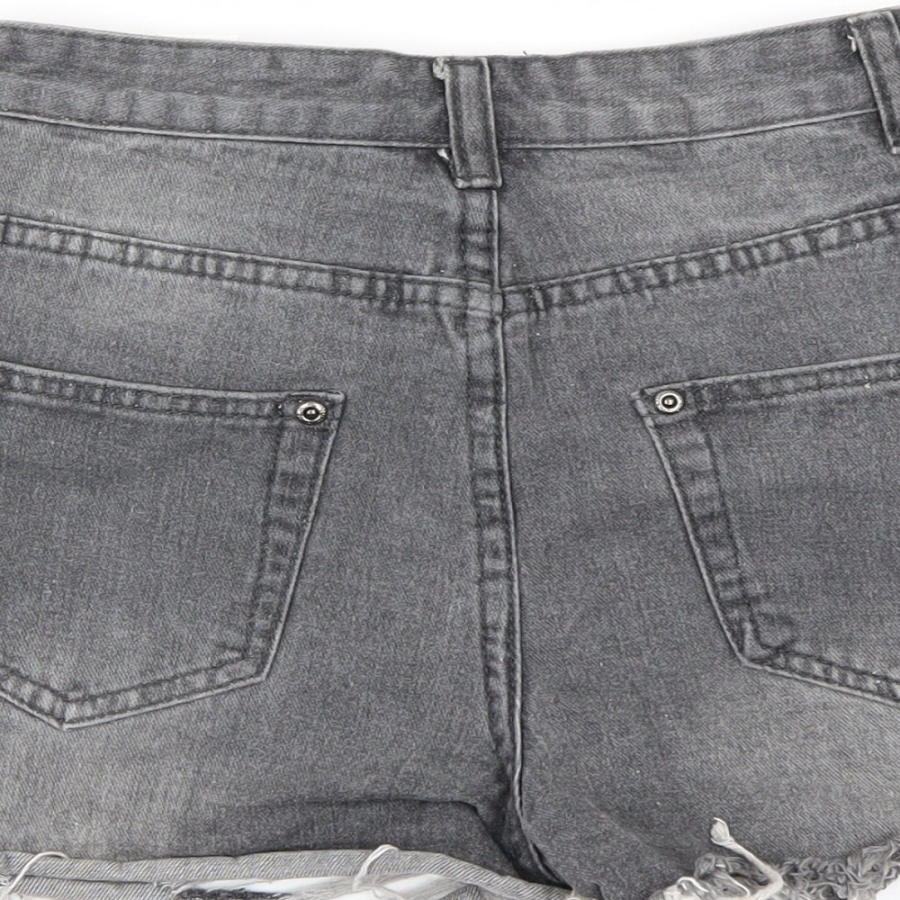 Brand and care label for PRETTYLITTLETHING women’s grey cut-off shorts, size UK 6