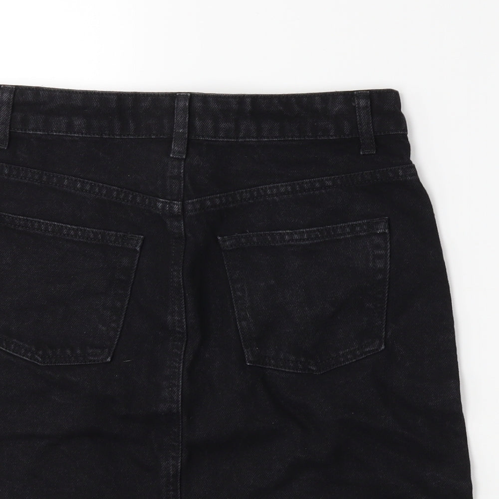 Brand and care label for Topshop women’s black denim mini skirt, size UK 8