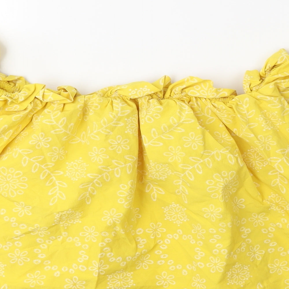 Brand and care label for Preworn women’s yellow floral basic blouse, size M
