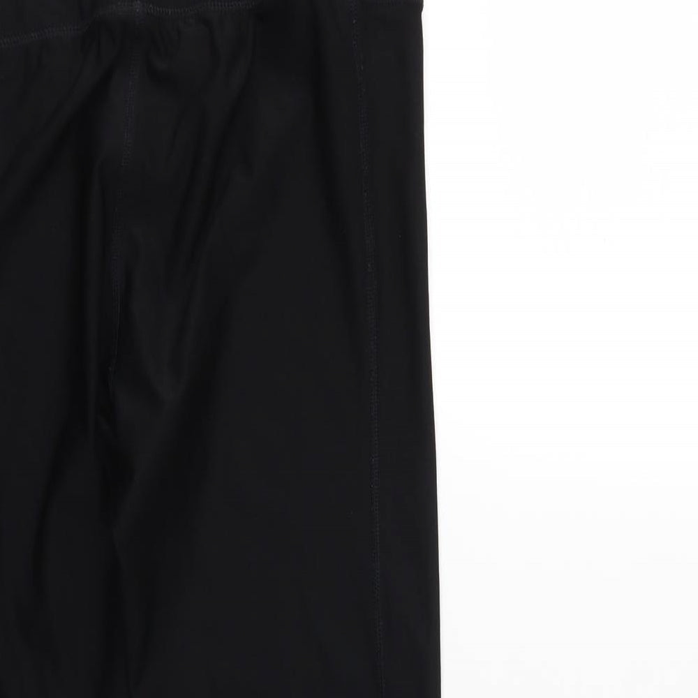 Brand and care label for athletic wear women’s black compression leggings, size S, 23-inch leg
