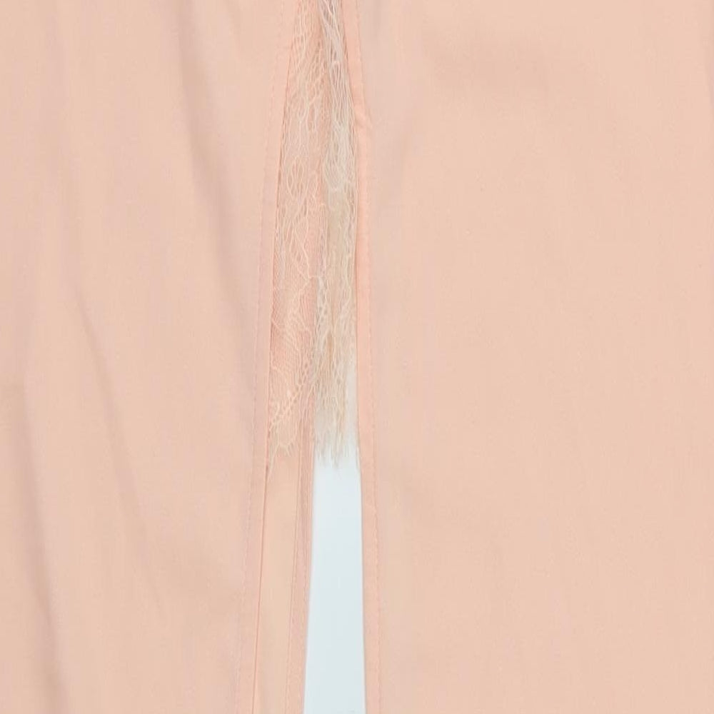 Brand and care label for Missguided women’s pink dress pants trousers, size UK 10, 36-inch leg - open legged
