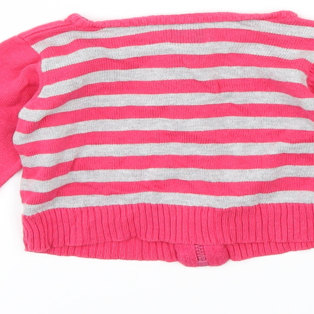 Brand and care label for Supergirl girls’ pink spotted jacket, size 6-9, months