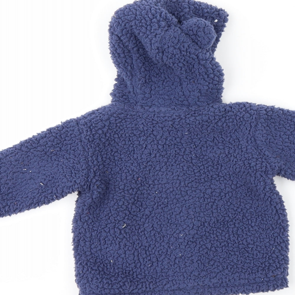 Brand and care label for Next girls’ blue fleece jacket, size 0-3, months - rabbit