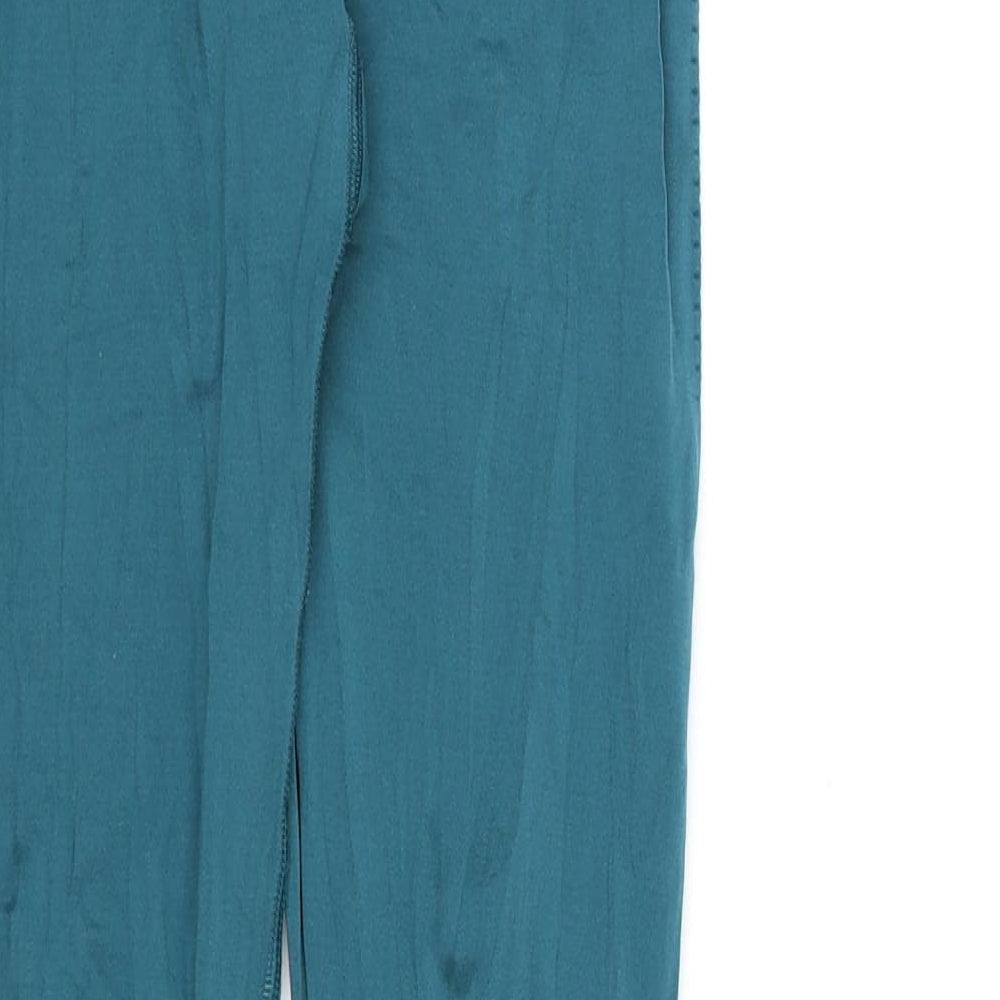 Brand and care label for Preworn women’s blue compression leggings, 27-inch leg
