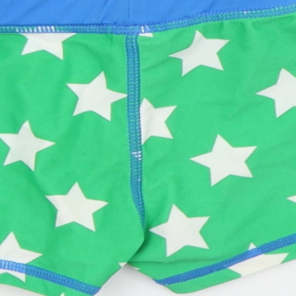 Brand and care label for F&F boys’ green capri trousers, size 12-18, months - swimming short