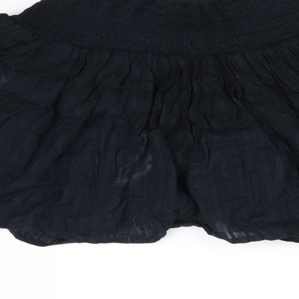 Brand and care label for Primark girls’ black flare skirt, size XS