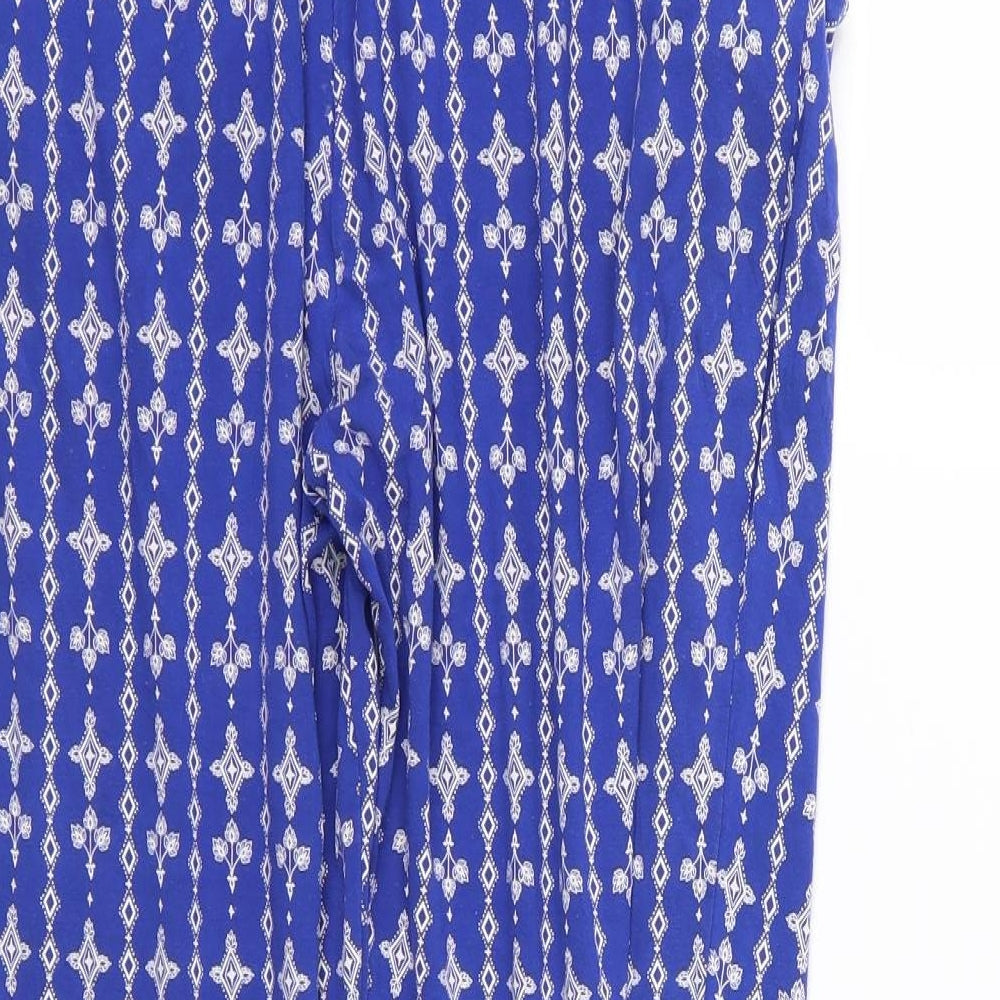 Brand and care label for Marks & Spencer women’s blue floral trousers, size UK 12, 27-inch leg