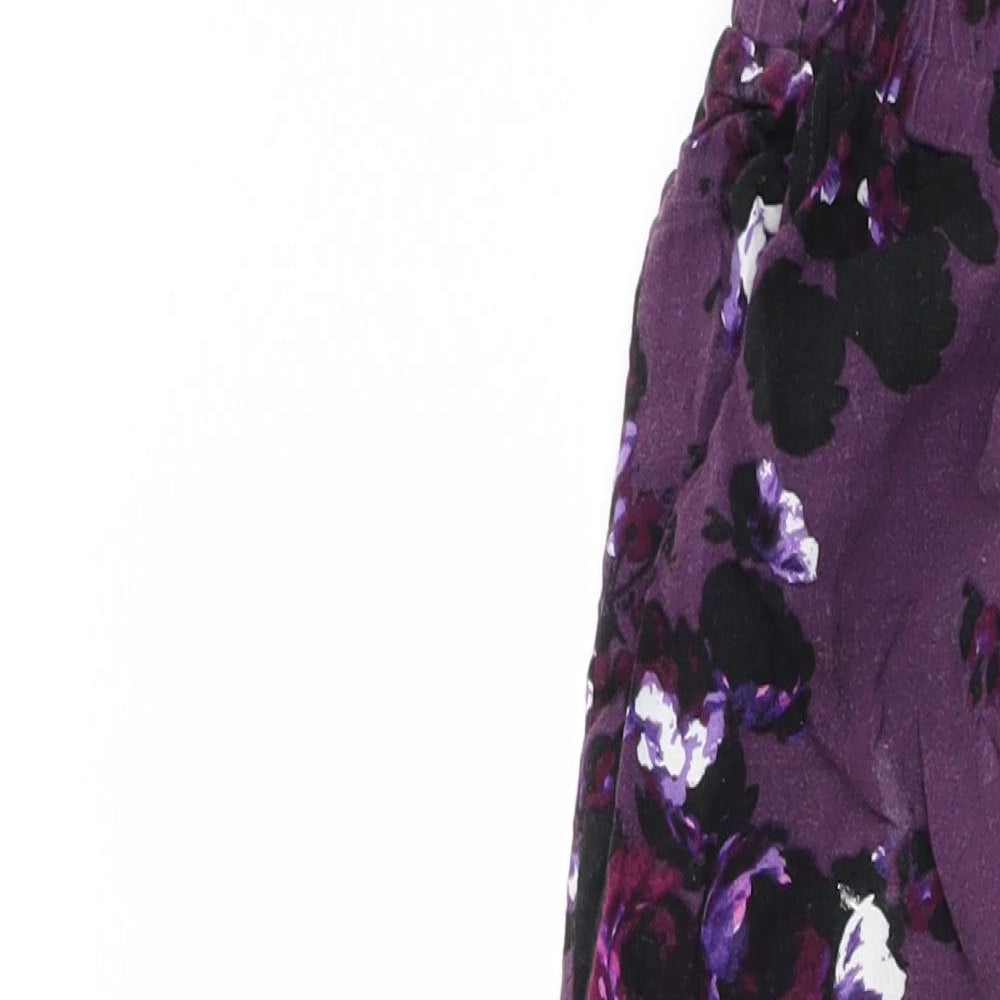 Brand and care label for Dorothy Perkins women’s purple floral trousers, size UK 12, 23-inch leg