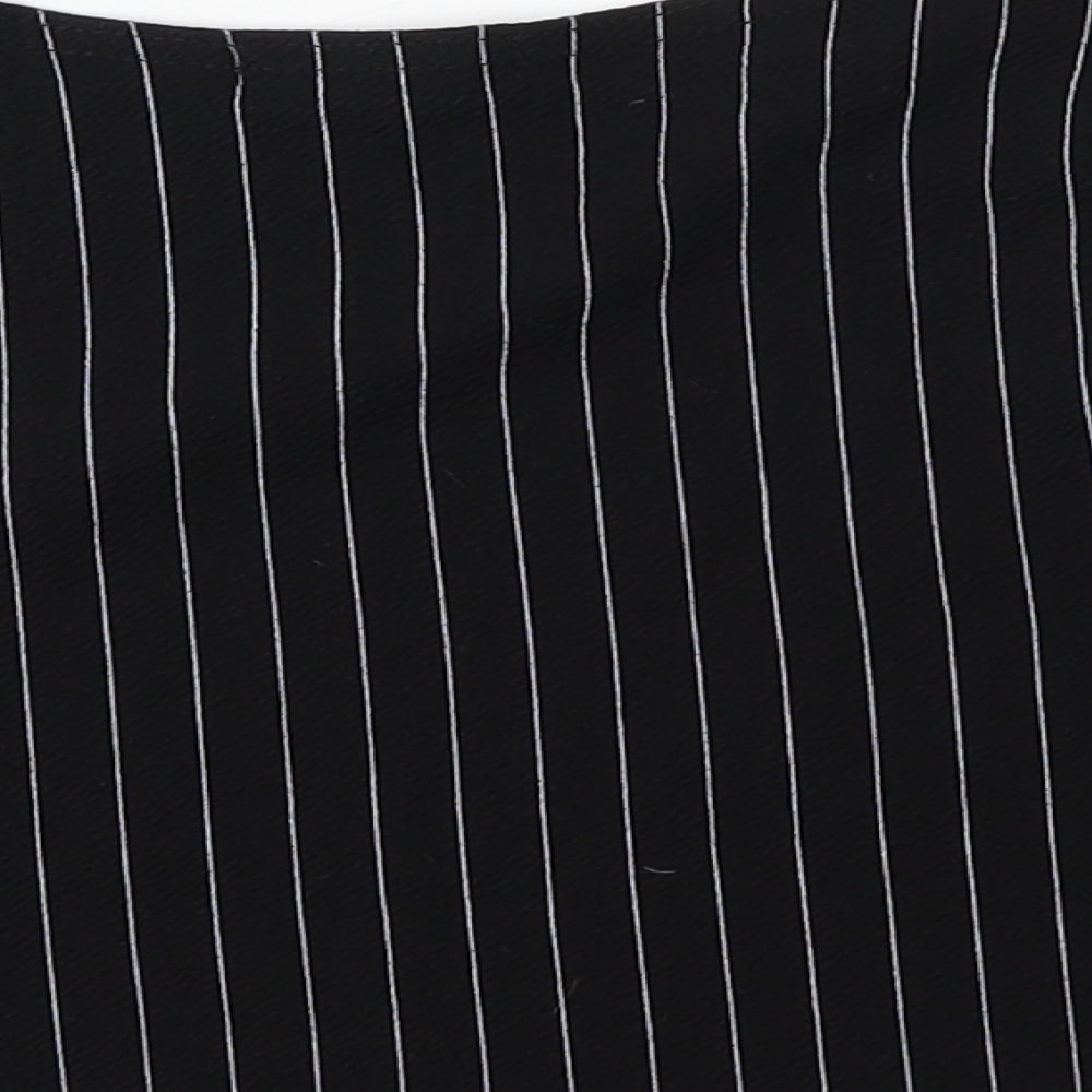 Brand and care label for PRETTYLITTLETHING women’s black striped basic t-shirt, size UK 8