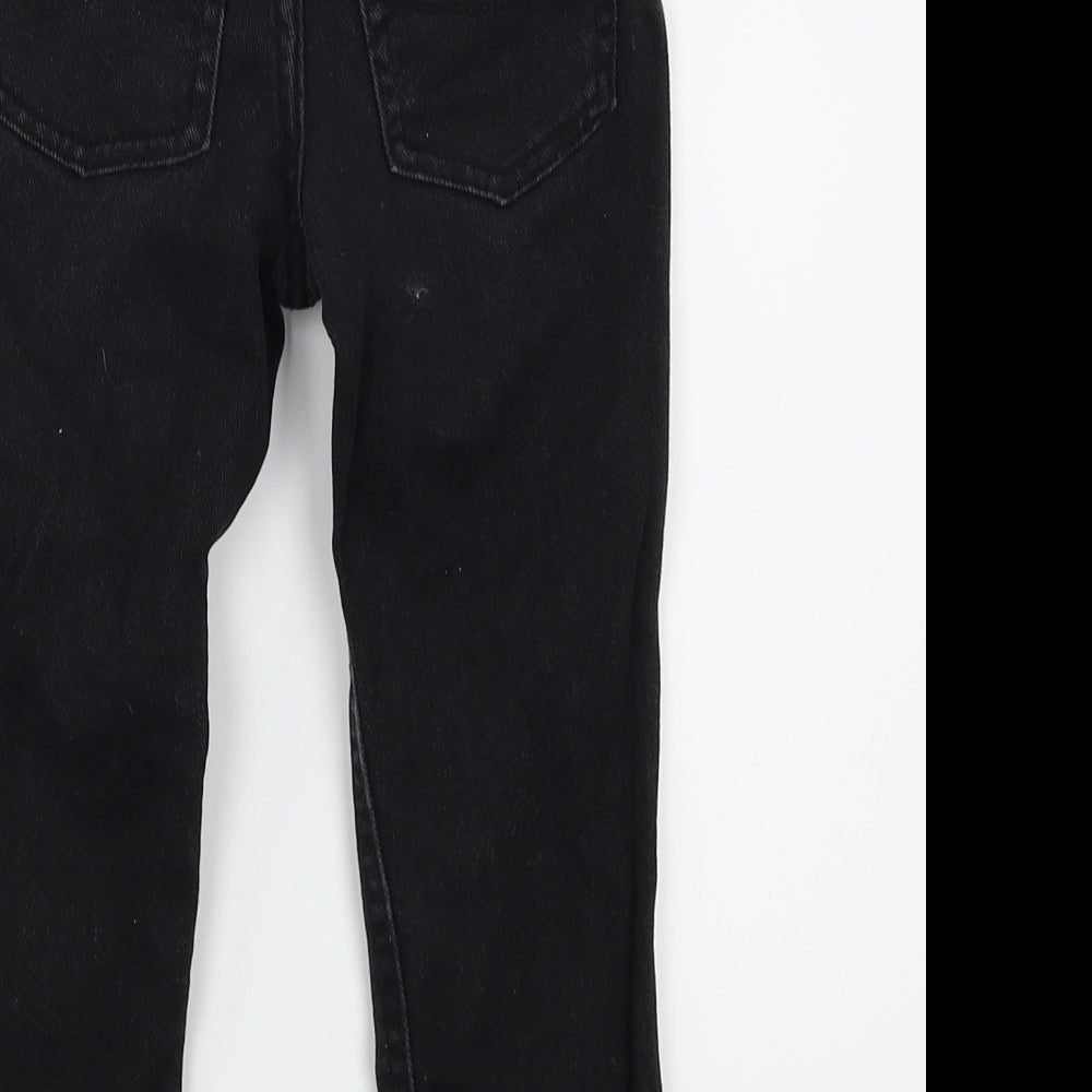 Brand and care label for Girl2girl girls’ black skinny jeans, size 3-4, years
