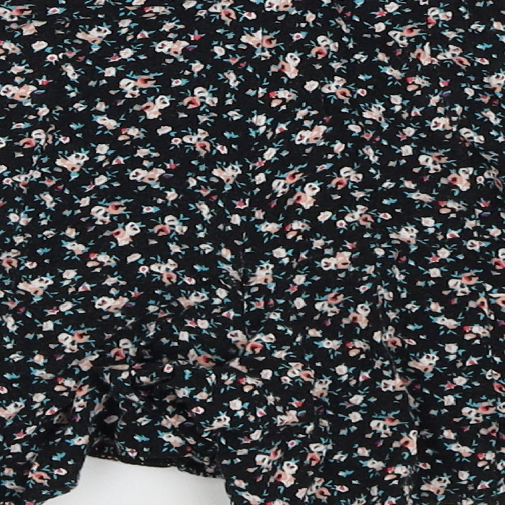Brand and care label for New Look girls’ black floral hot pants shorts, size 9, years